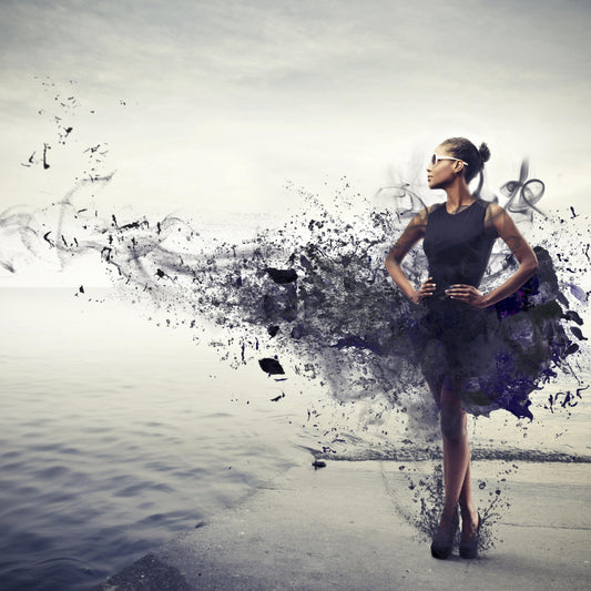 fantasy image of a woman wearing a little black dress that is blowing into pieces